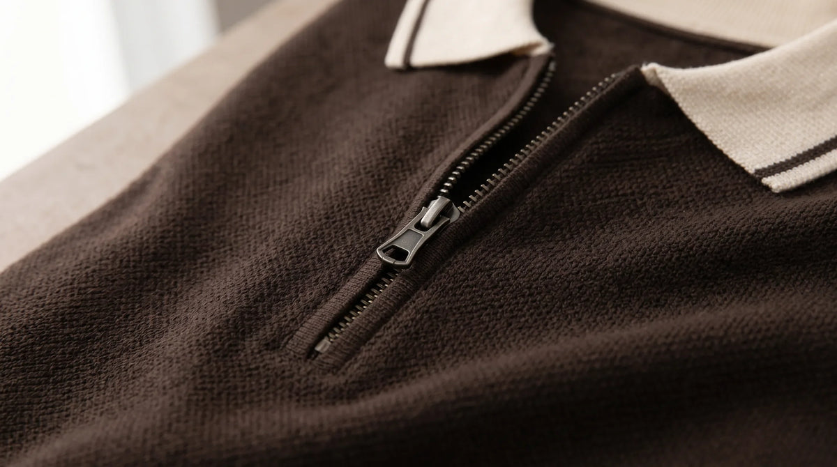Close-up of the Ameglia Knit Polo's contrast collar and zip placket