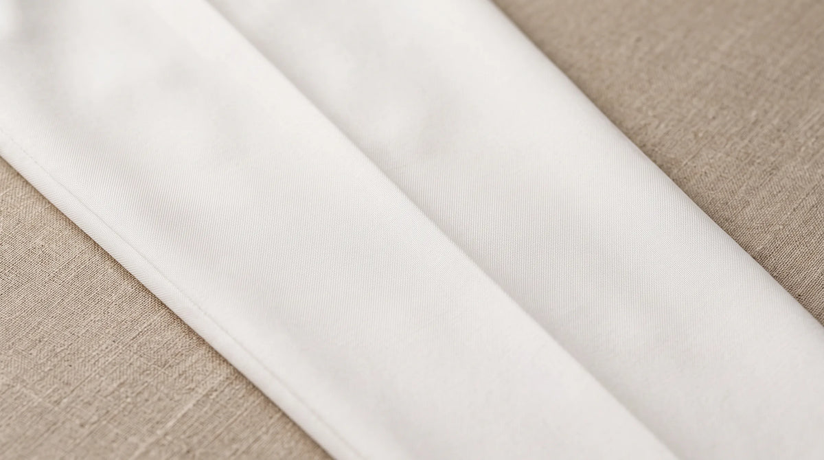 Close-up of the Cervo Pleated Trouser's pressed crease and cloth