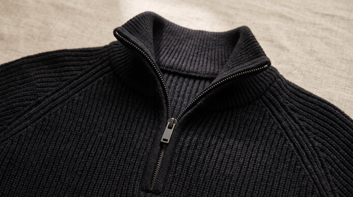 Close-up of the Como Black Half-Zip Knit's ribbed collar and half zip