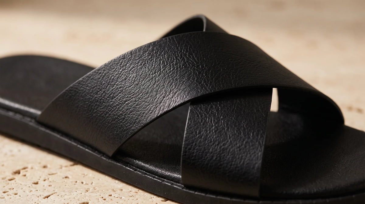Close-up of The Cove Sandals crossed black straps