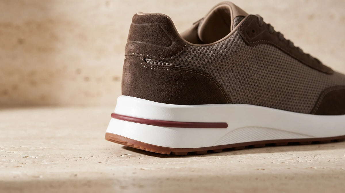 Close-up of the Espresso Cove Trainer's striped sole and heel