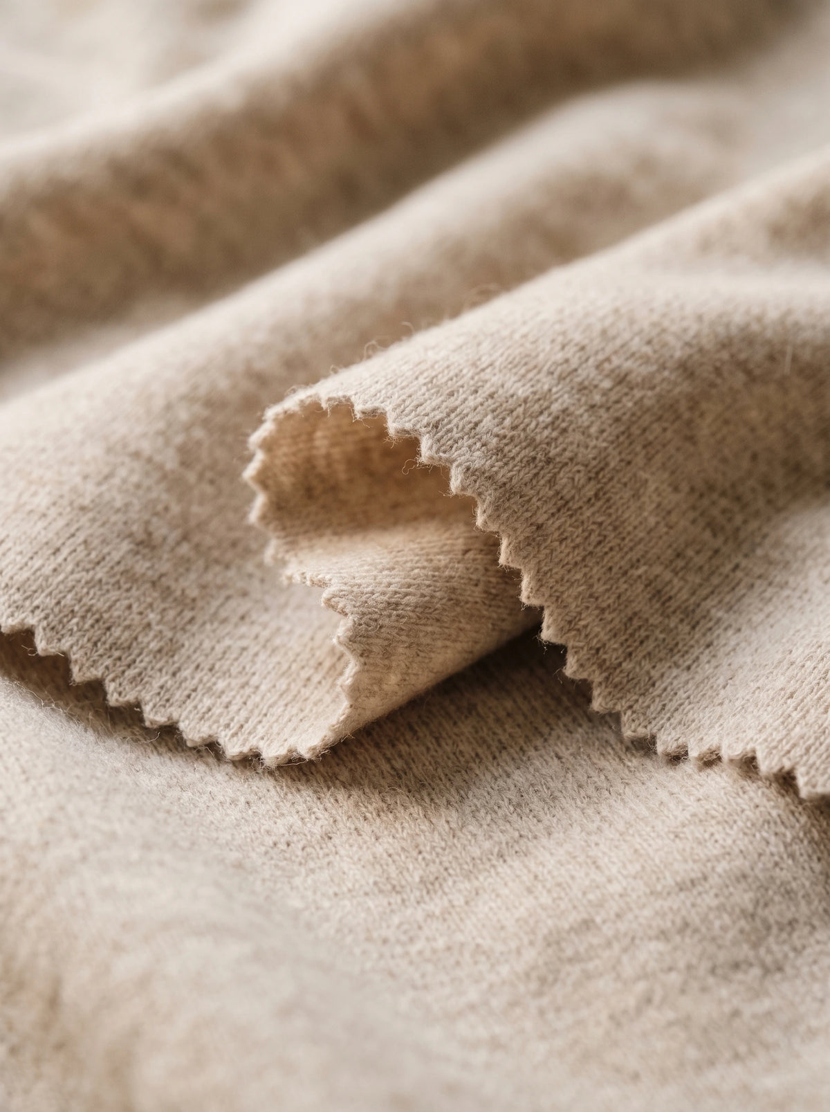 A close view of the brushed knit, cut with a pinked edge