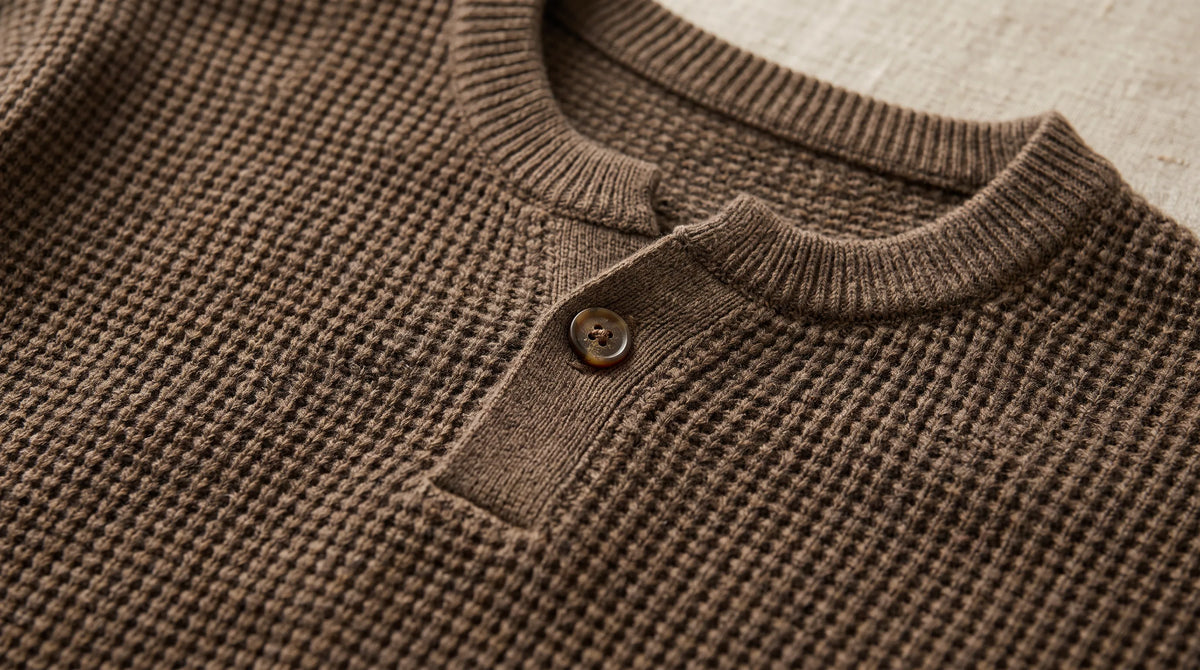 Close-up of the Lerici Brown Knitted Sweater's henley button placket