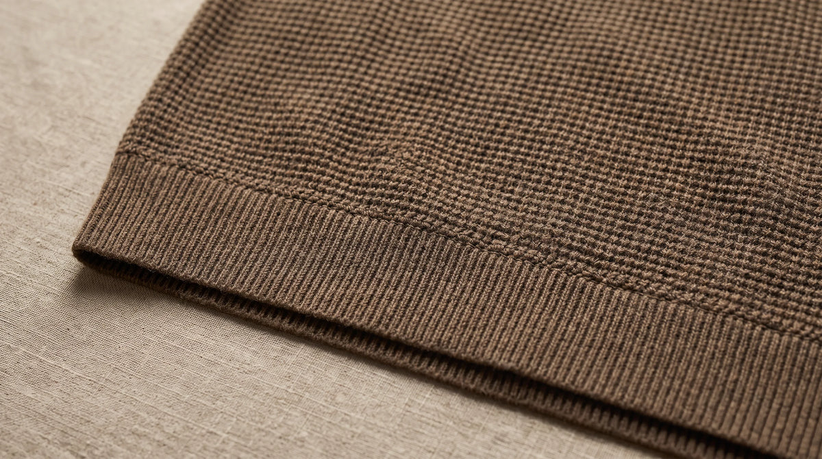 Close-up of the Lerici Brown Knitted Sweater's hem and waffle knit