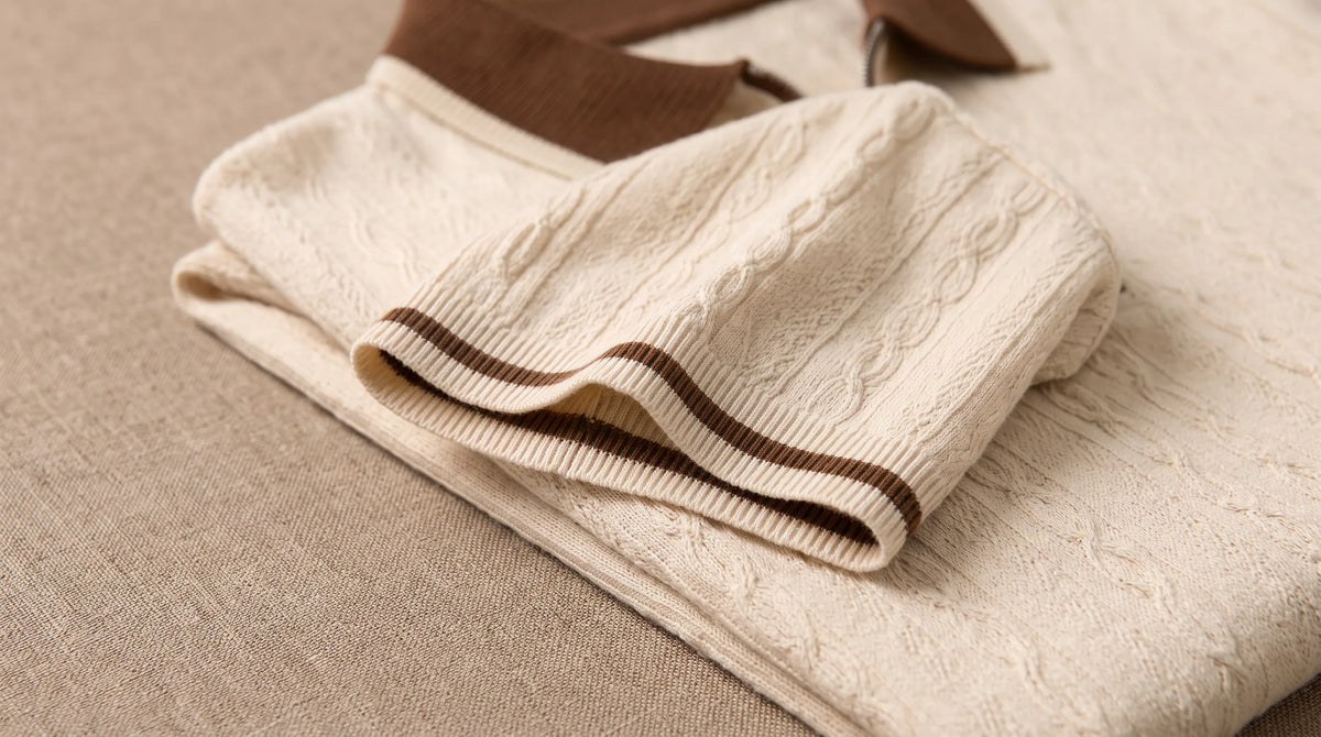 Close-up of the Maiori Knit Polo's tipped cuff and fine cable texture
