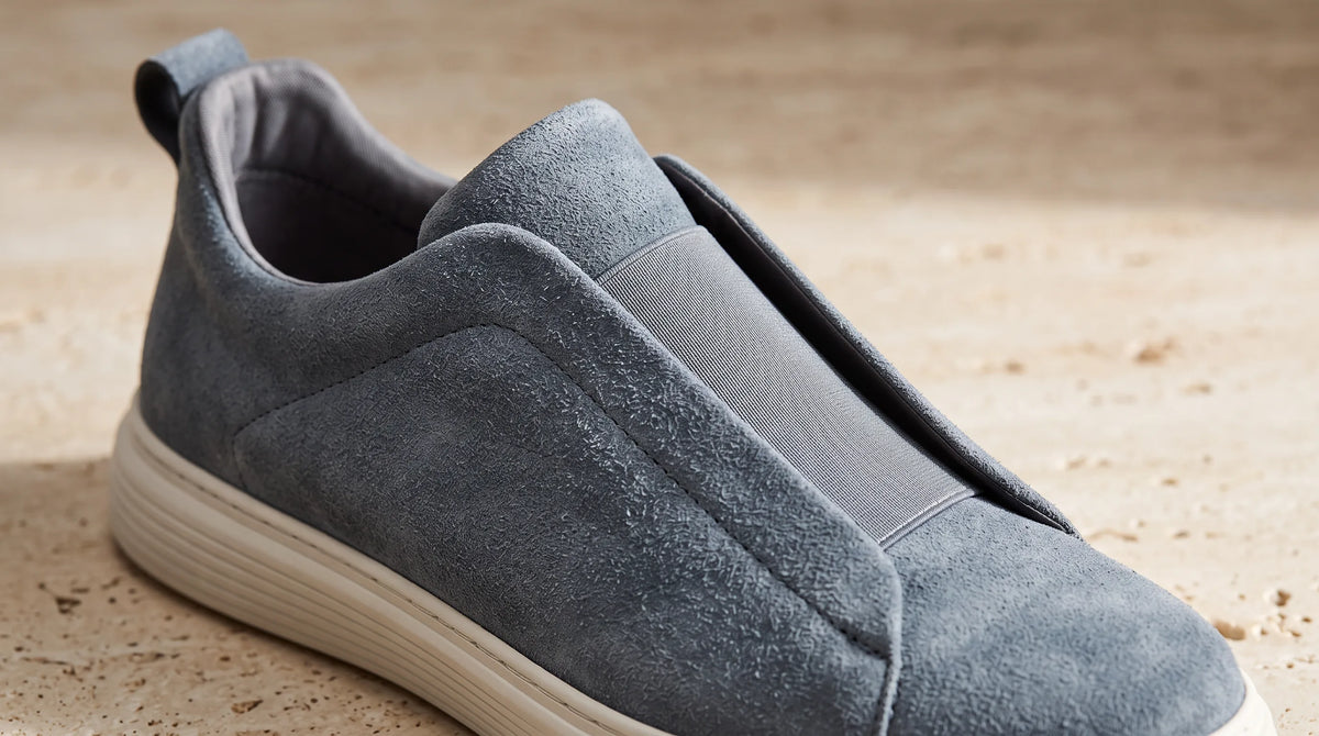 Close-up of the Milano Gray Sneakers' suede upper and slip-on opening