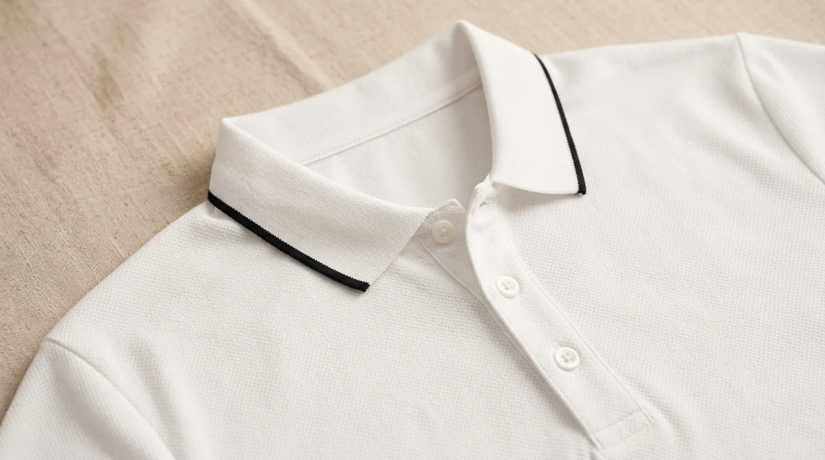 Close-up of the black-tipped collar and three-button placket