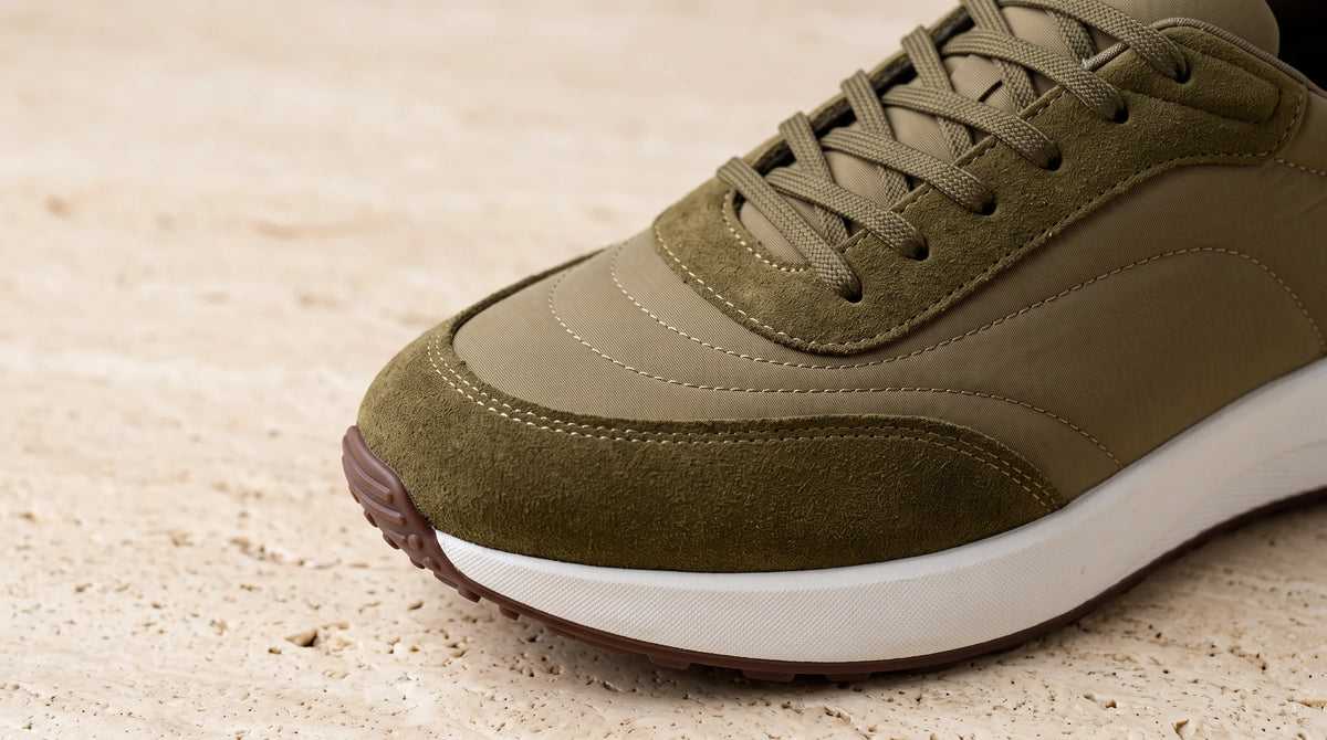 Close-up of the Olive Cove Trainer's suede and mesh upper
