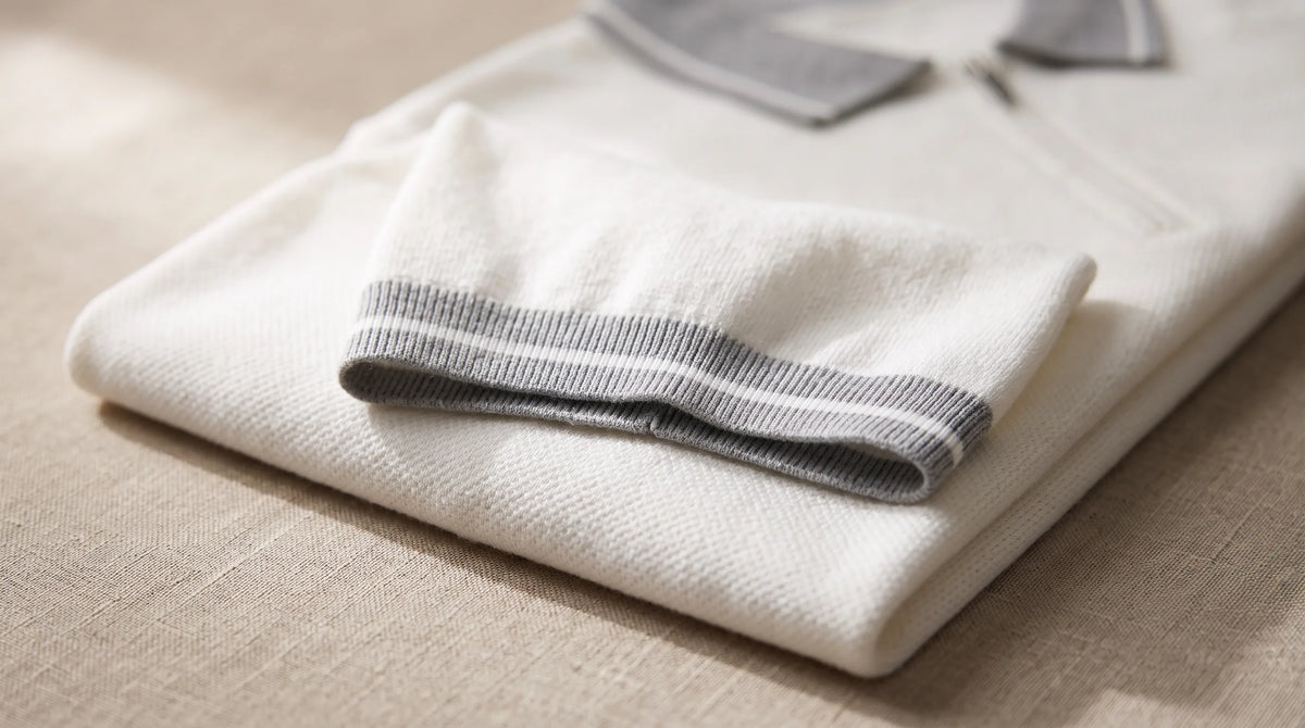 Close-up of the Paraggi Knit Polo's tipped cuff and fine textured knit