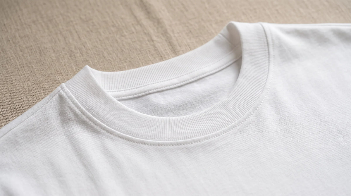 Close-up of the Positano White Tee's ribbed crew neck