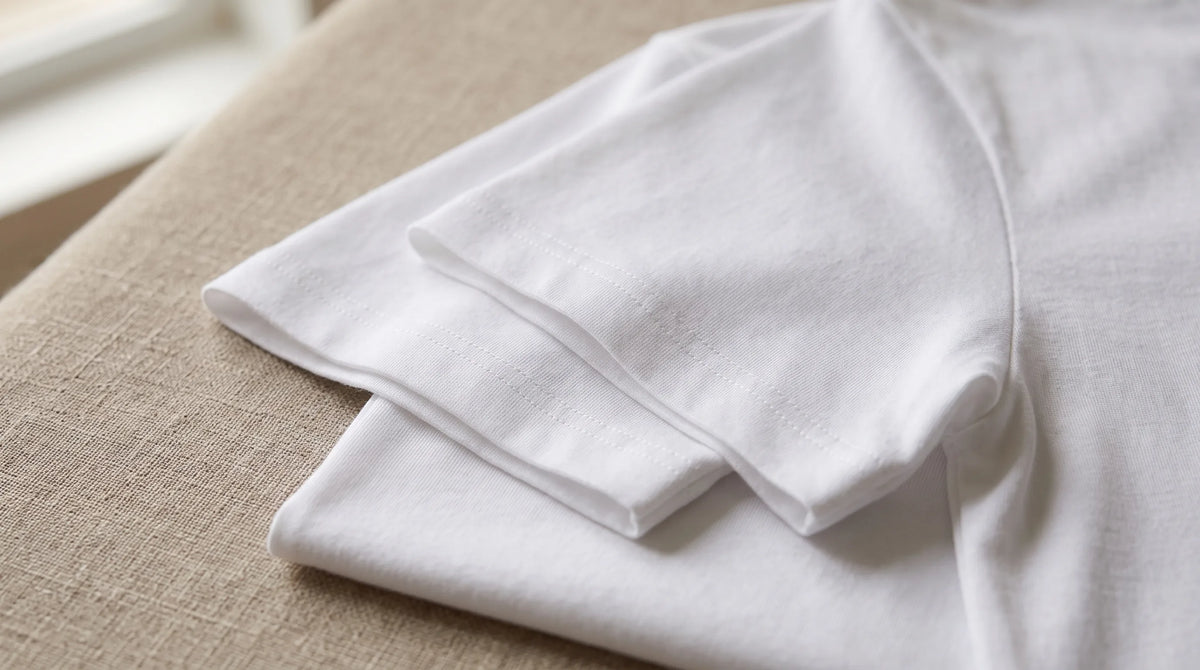 Close-up of the Positano White Tee's sleeve hem and jersey