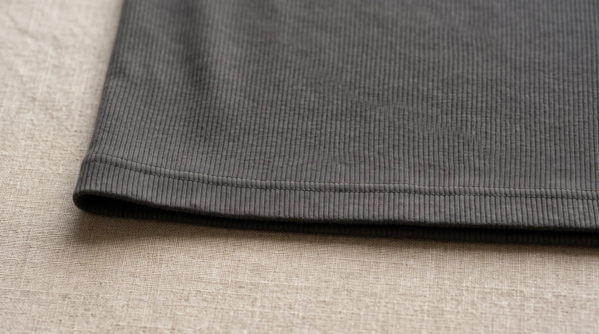 Close-up of the Ravello Gray Henley's hem and fine rib knit