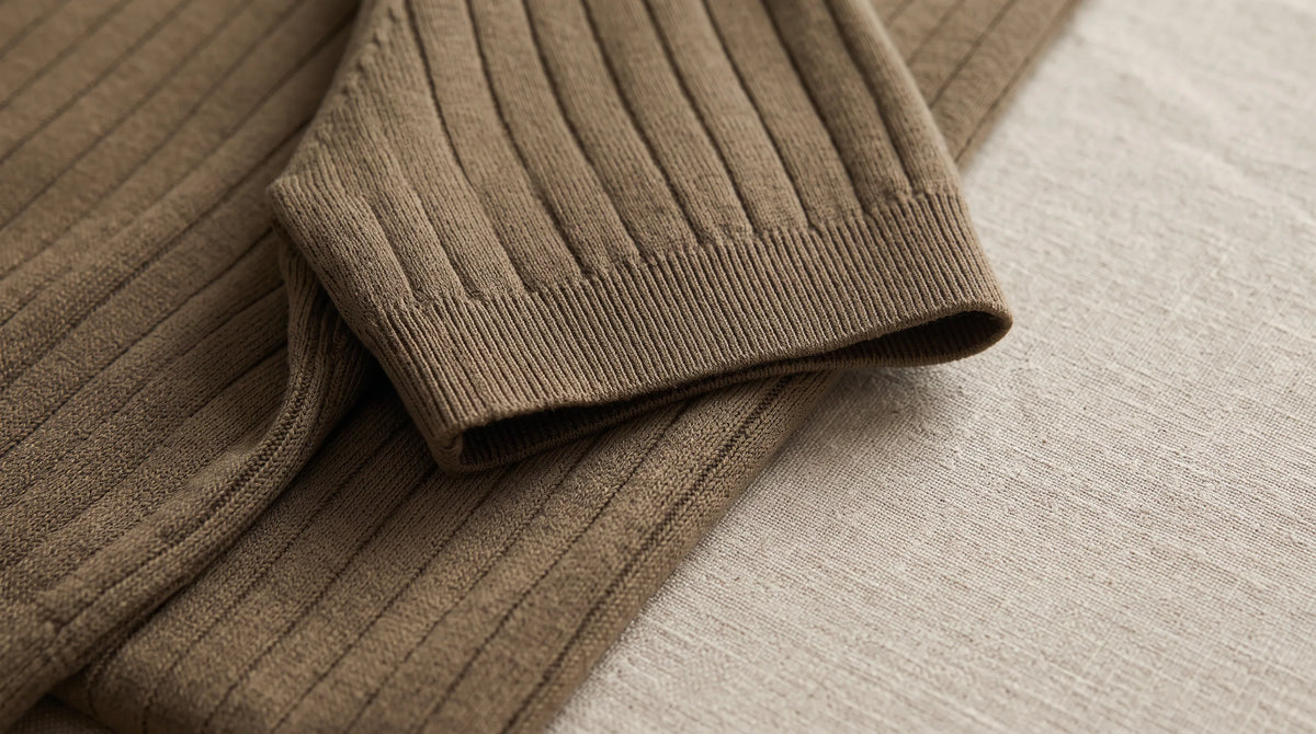 Close-up of the Riviera Ribbed Polo's sleeve and fine vertical rib knit
