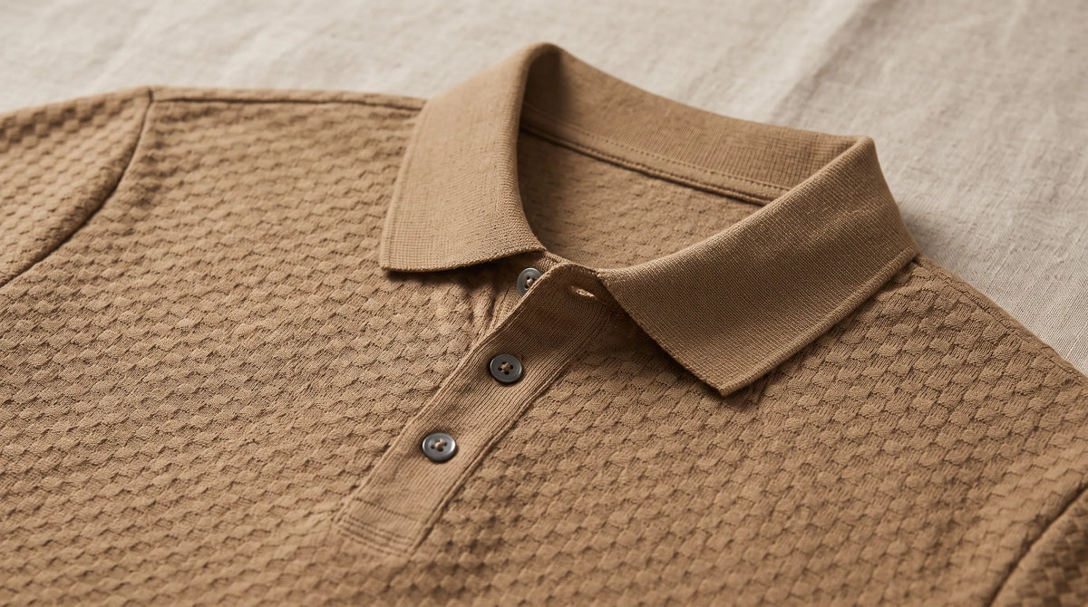 Close-up of the Saint-Tropez Textured Polo's spread collar and button placket