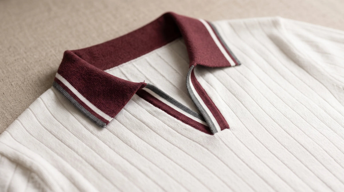 Close-up of the Tellaro Knit Polo's burgundy open collar with white and grey tipping