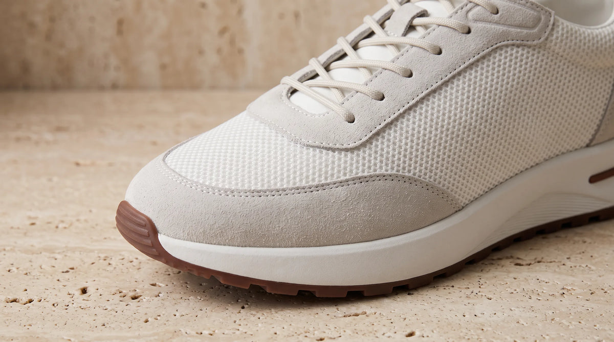 Close-up of the White Cove Trainer's suede and mesh upper
