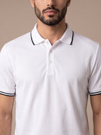 Close-up of the black-tipped collar and three-button placket