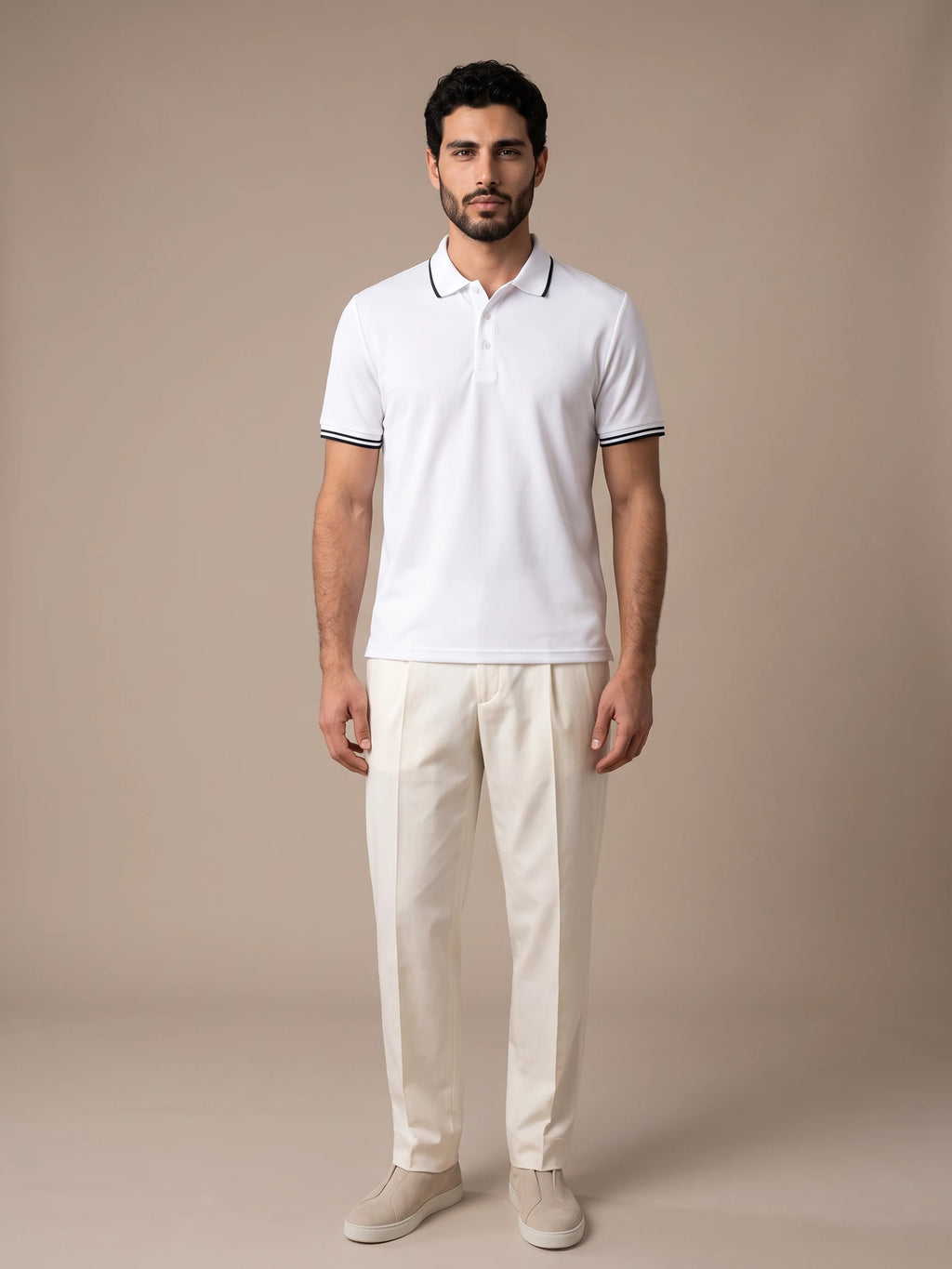 Model wearing the Morino White Polo with ivory trousers