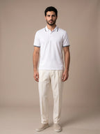 Model wearing the Morino White Polo with ivory trousers