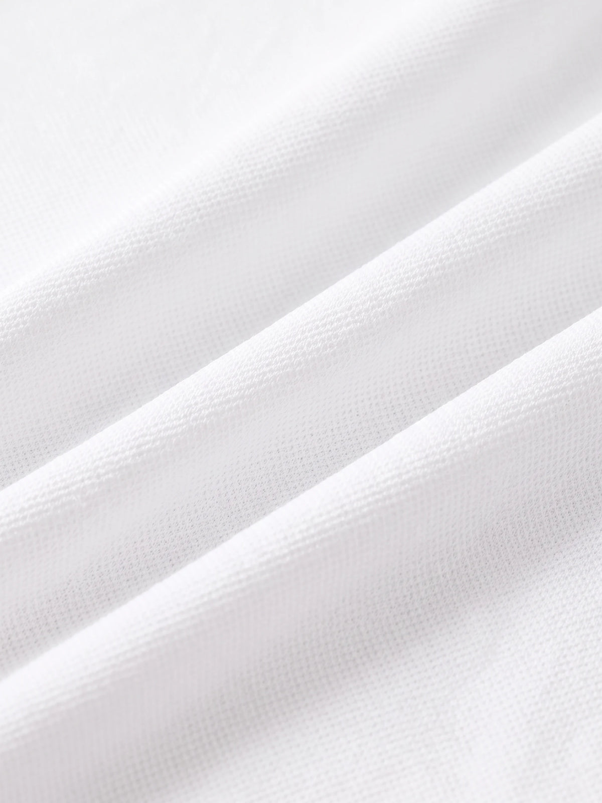 Close detail of the white bamboo-fibre piqué