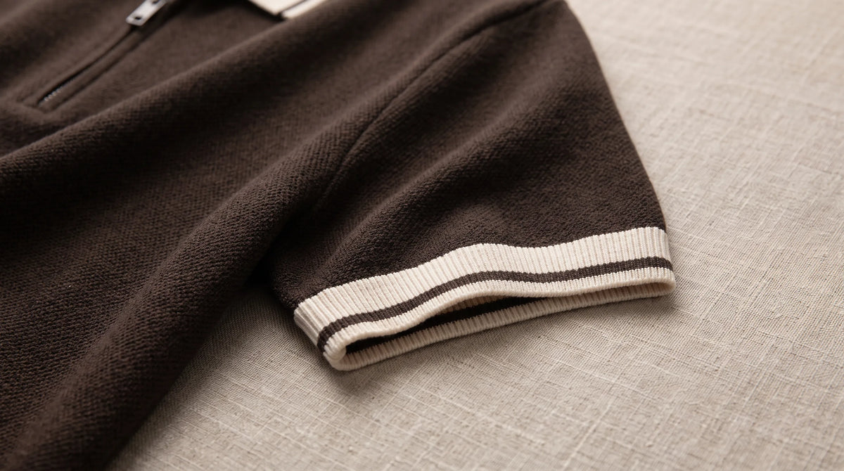 Close-up of the Ameglia Knit Polo's tipped cuff and fine textured knit
