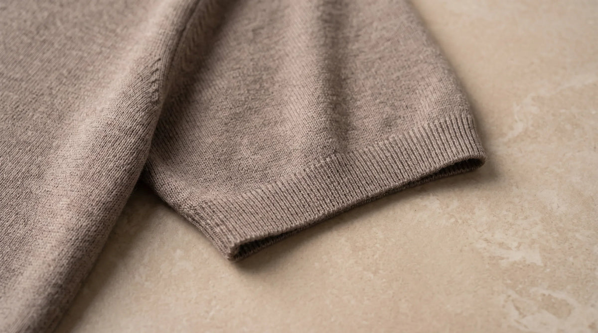 Close-up of the Bellagio Knit Polo's ribbed cuff and fine knit