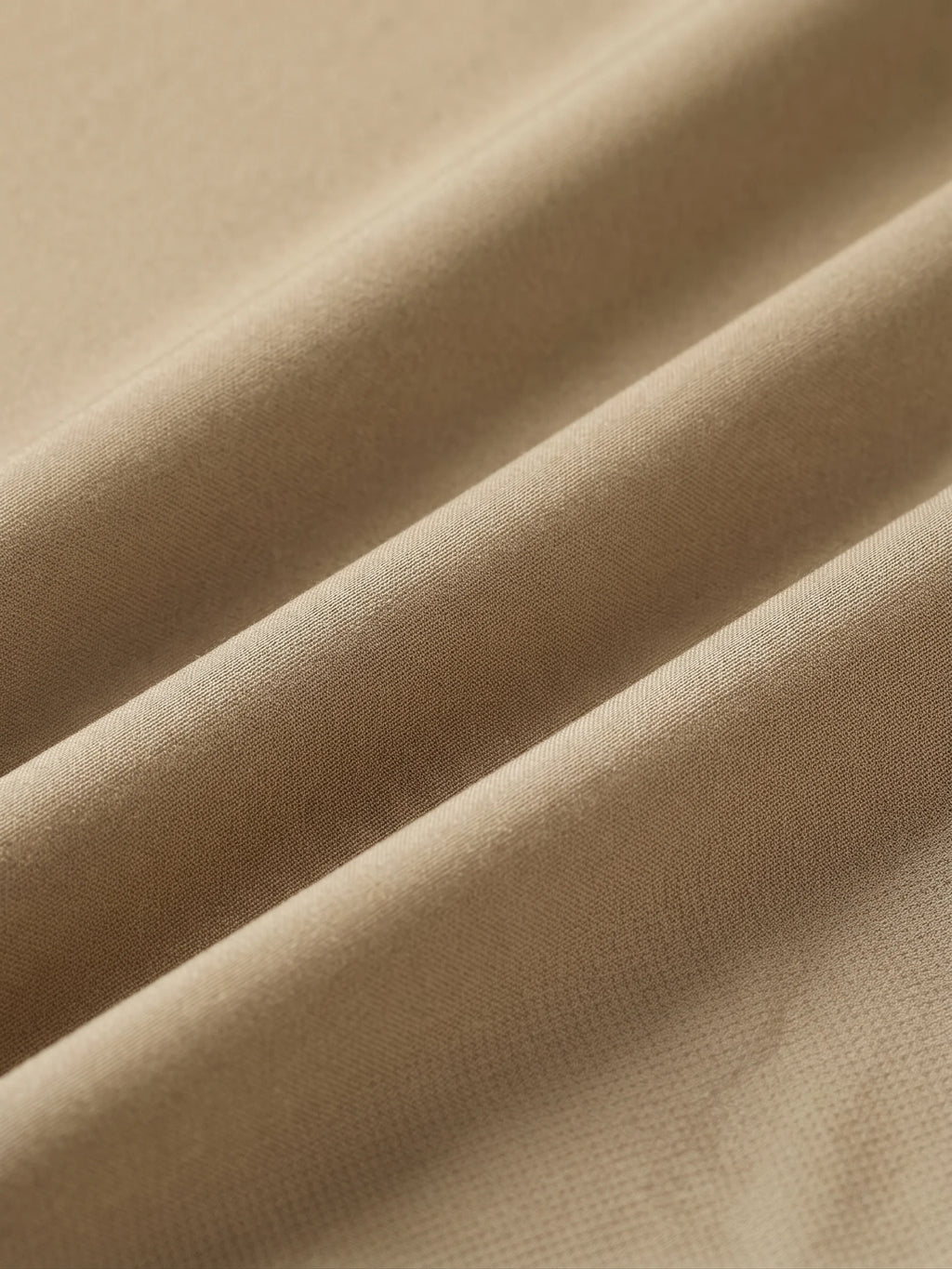 Close detail of the khaki woven shell
