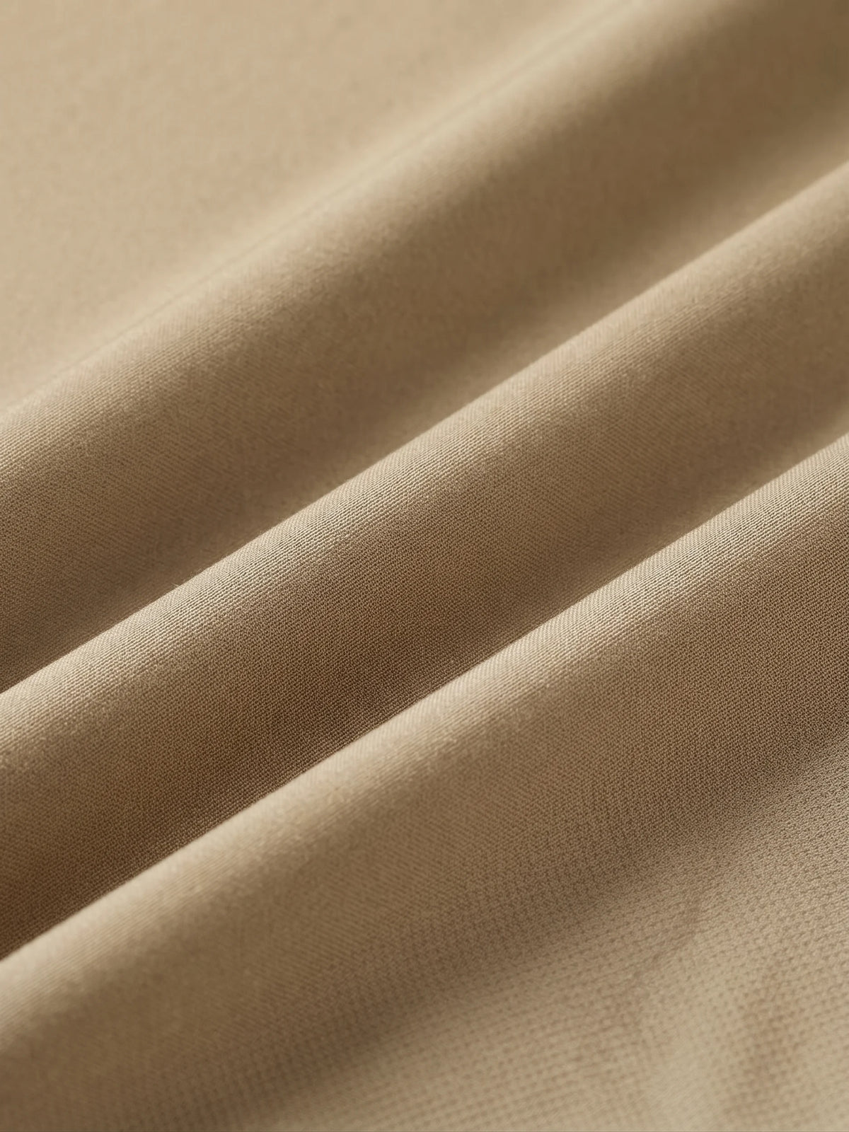 Close detail of the khaki woven shell