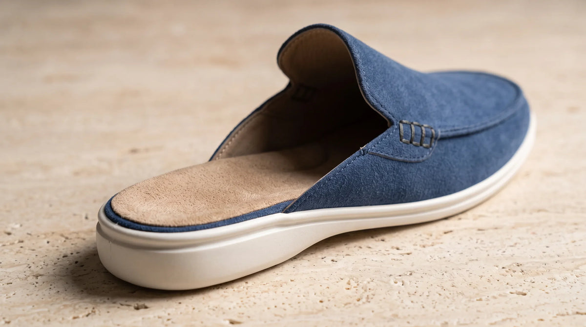 Close-up of the Cove Blue Mule's open back and white sole