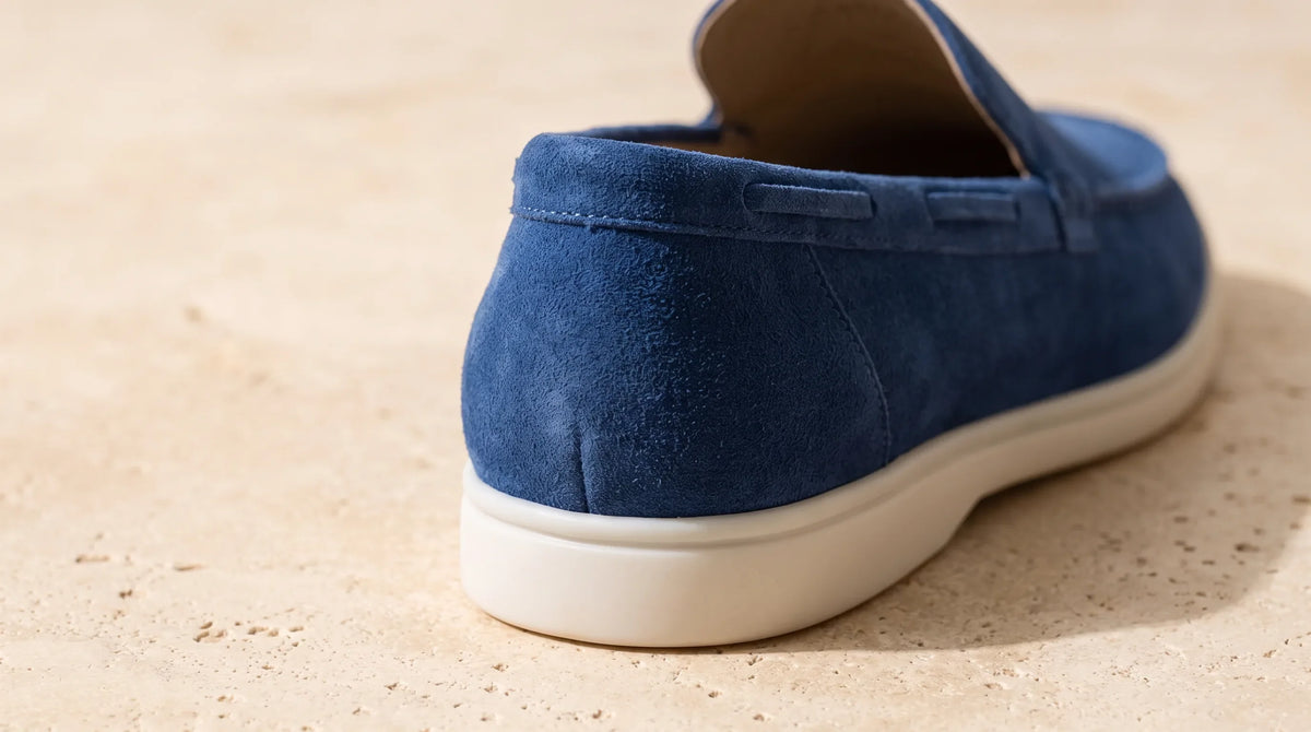 Close-up of the Dark Blue Yacht Loafers' white sole and napped upper