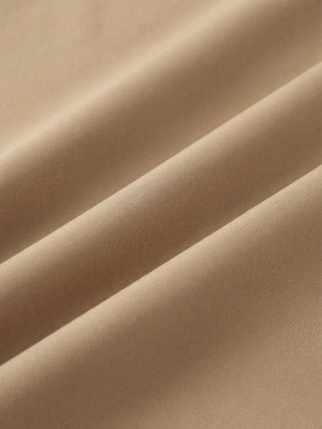 Close detail of the khaki woven shell