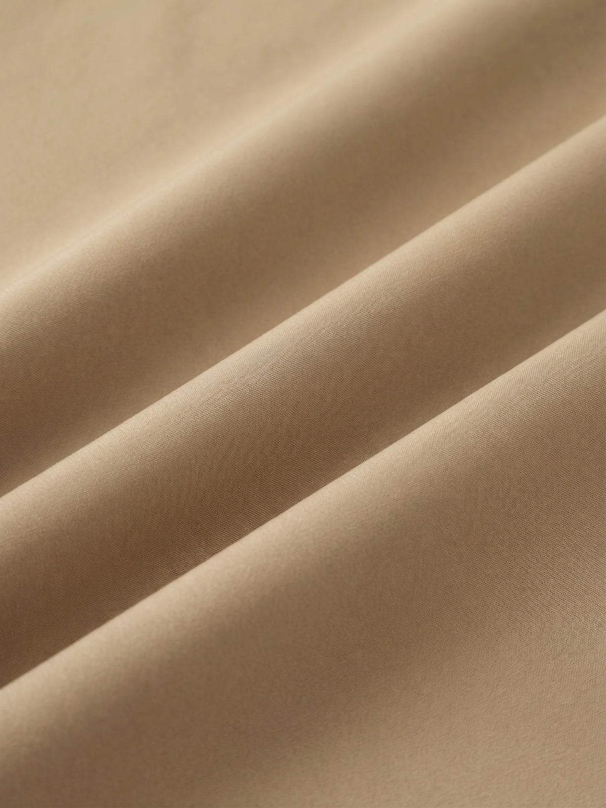 Close detail of the khaki woven shell