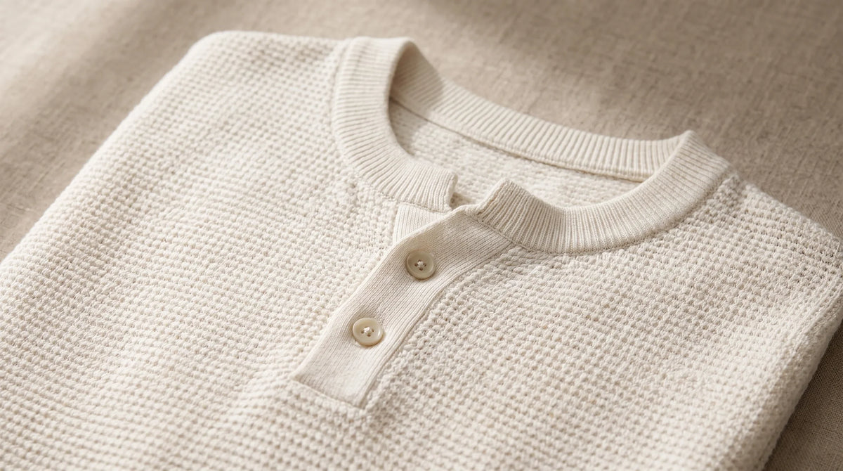 Close-up of the Lerici White Knitted Sweater's henley button placket