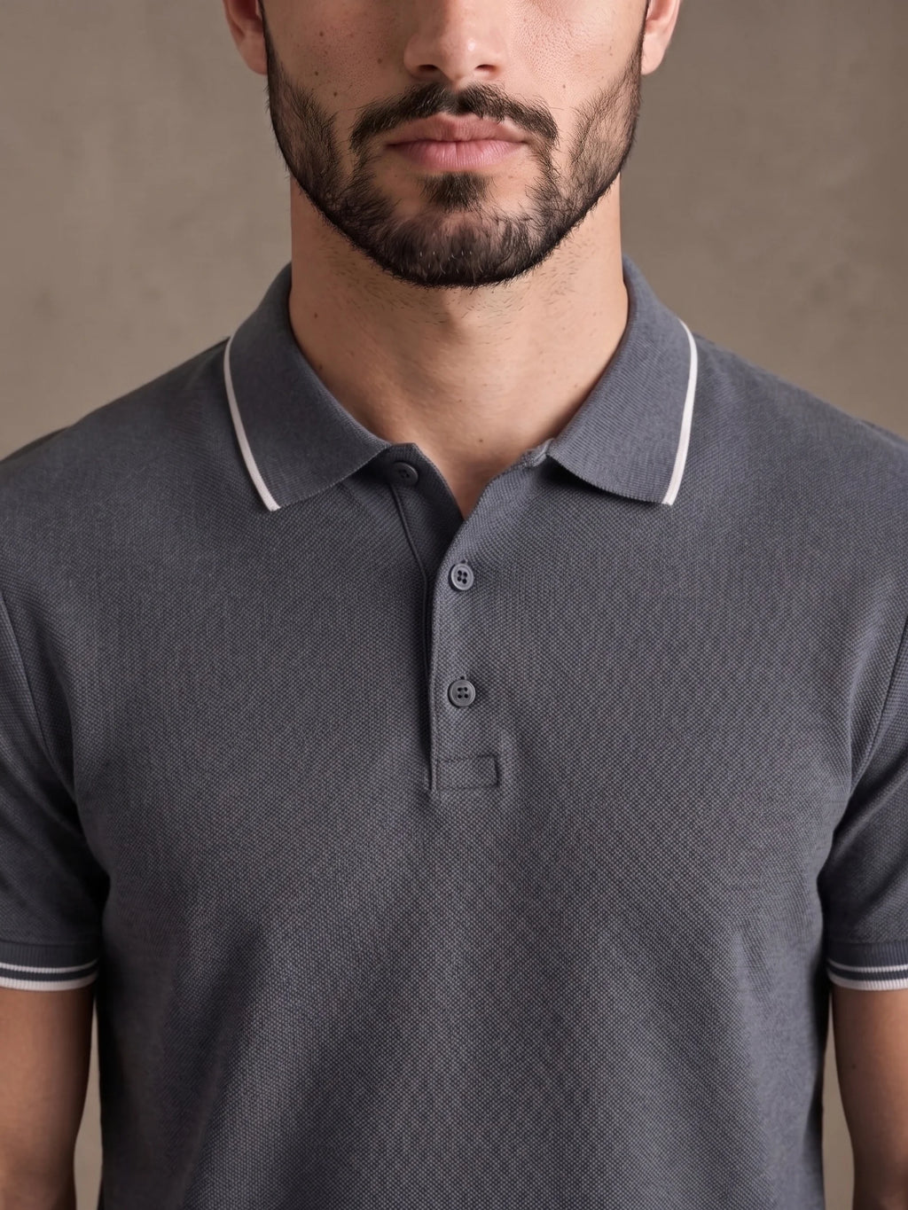 Close-up of the white-tipped collar and three-button placket