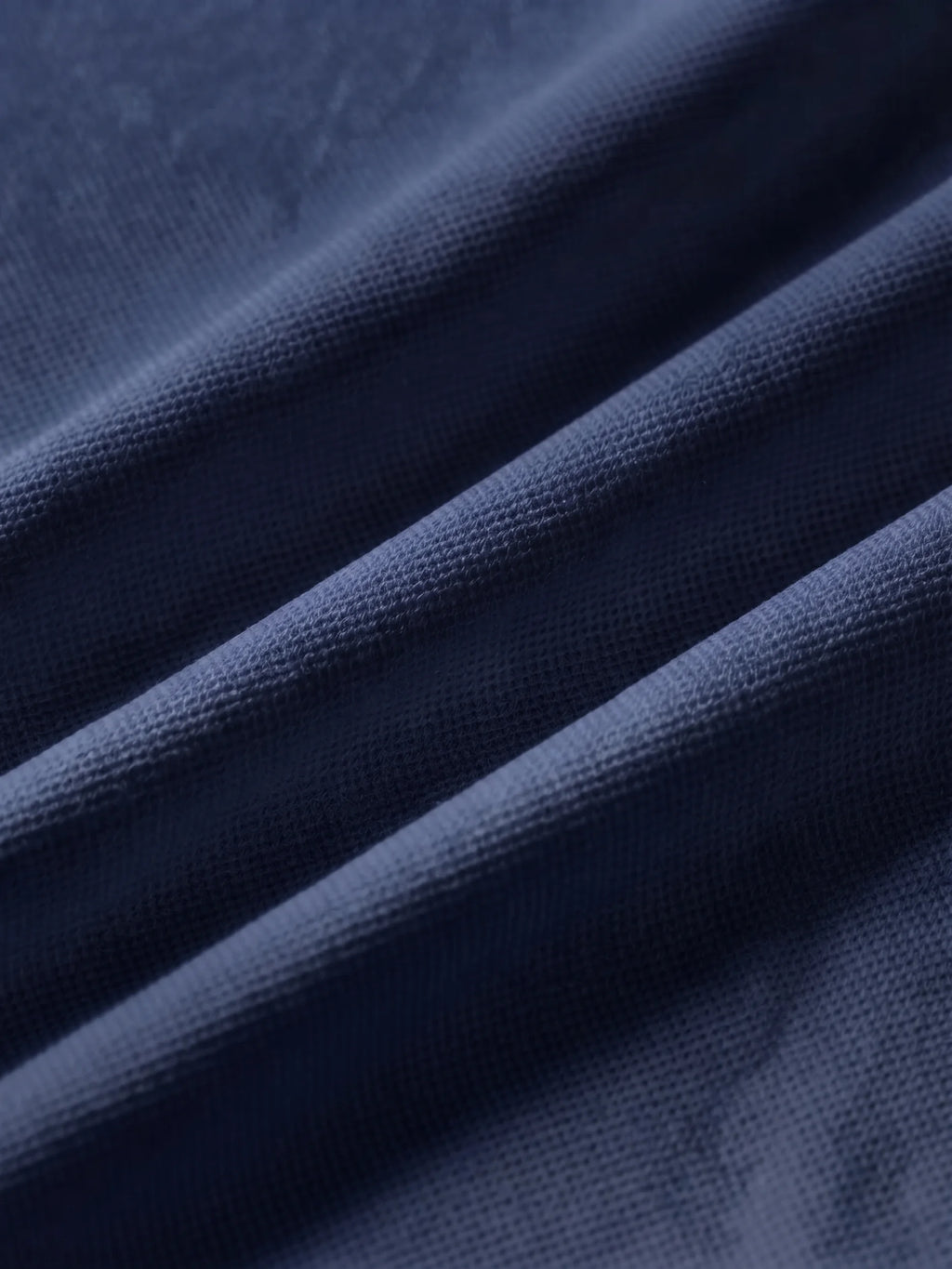 Close detail of the navy bamboo-fibre piqué