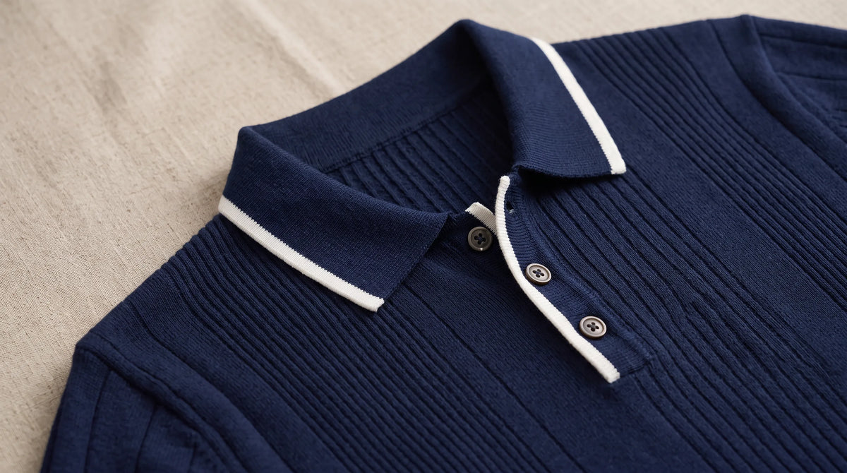 Close-up of the Portovenere Knitted Sweater's white tipped collar and button placket