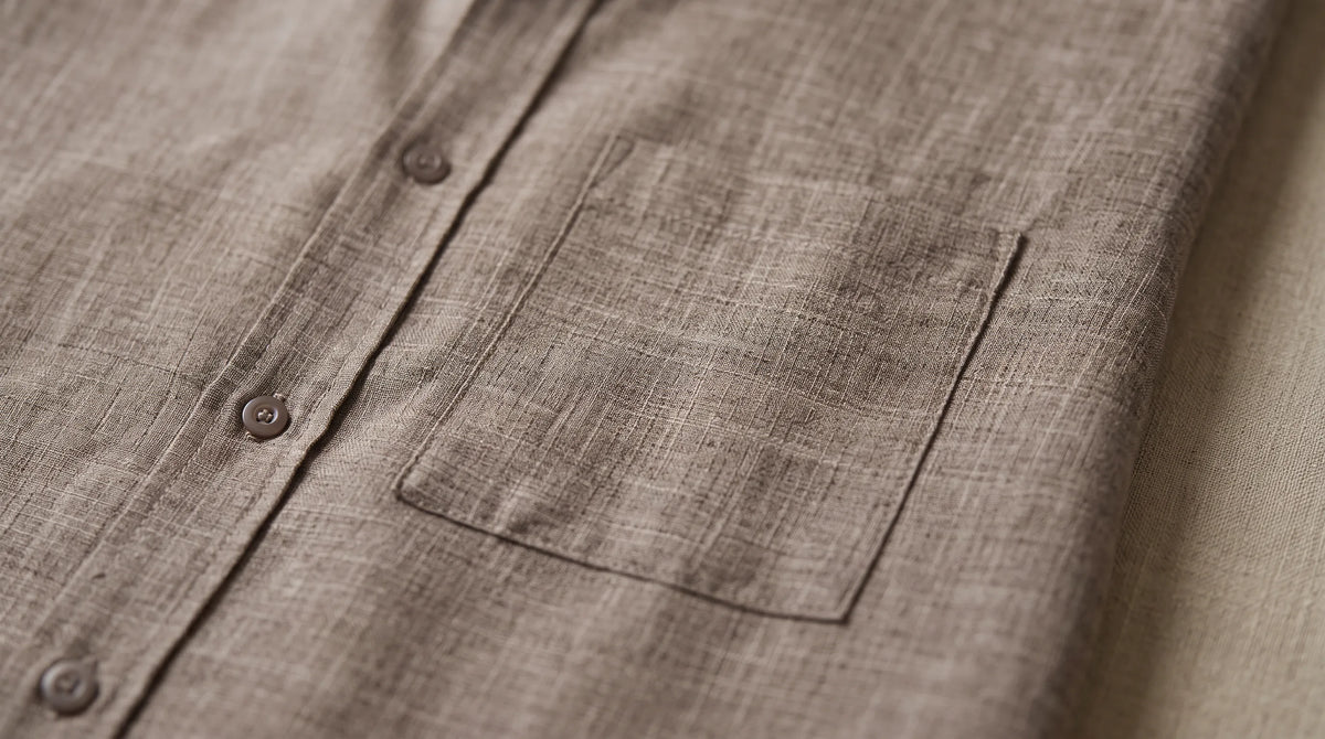Close-up of the Portside Linen Polo's chest pocket and slub weave