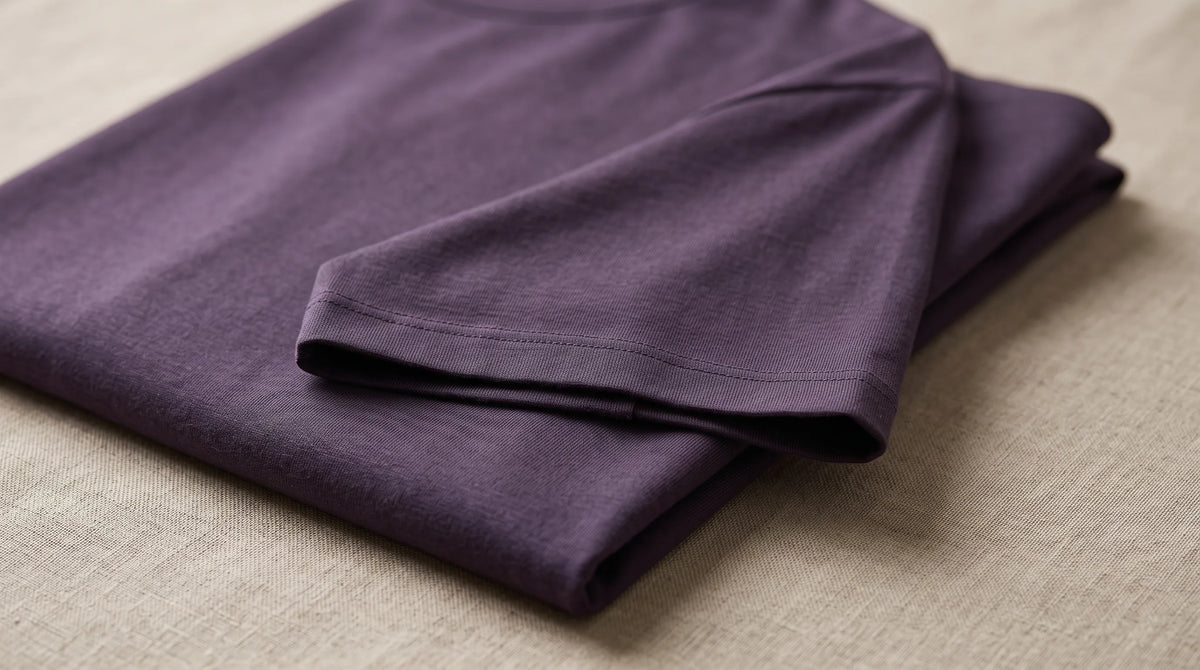 Close-up of the Positano Aubergine Tee's sleeve hem and jersey
