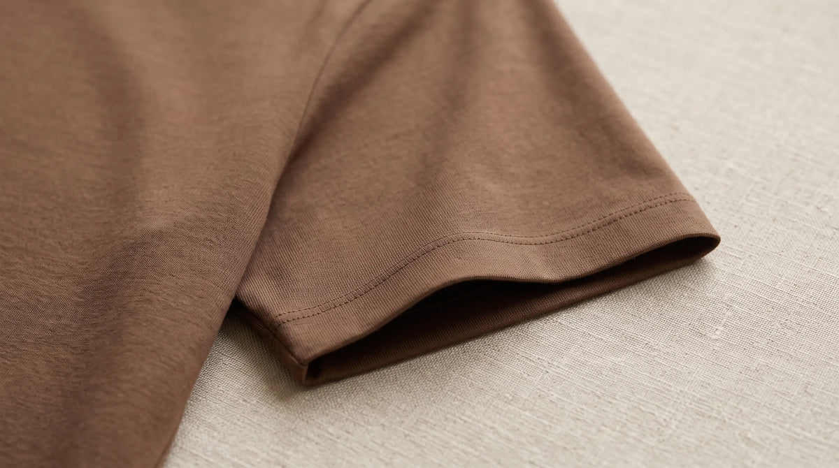 Close-up of the Positano Mocha Tee's sleeve hem and jersey