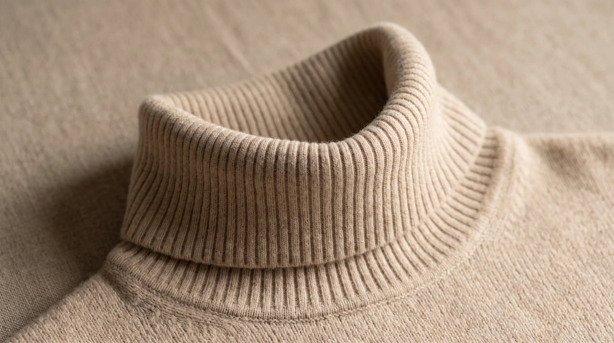 Close-up of the Riva Beige Roll-Neck's folded roll neck