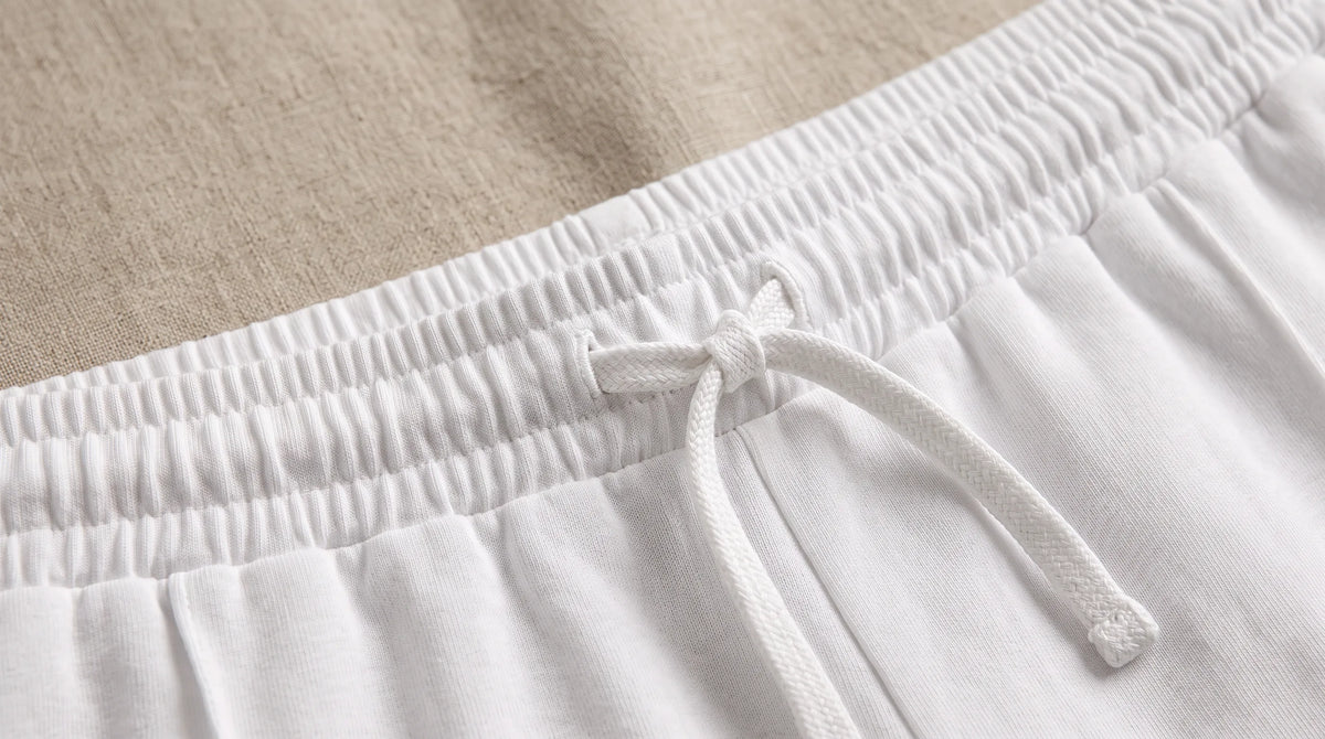 Close-up of the White Drawstring Yacht Trousers' drawstring waistband
