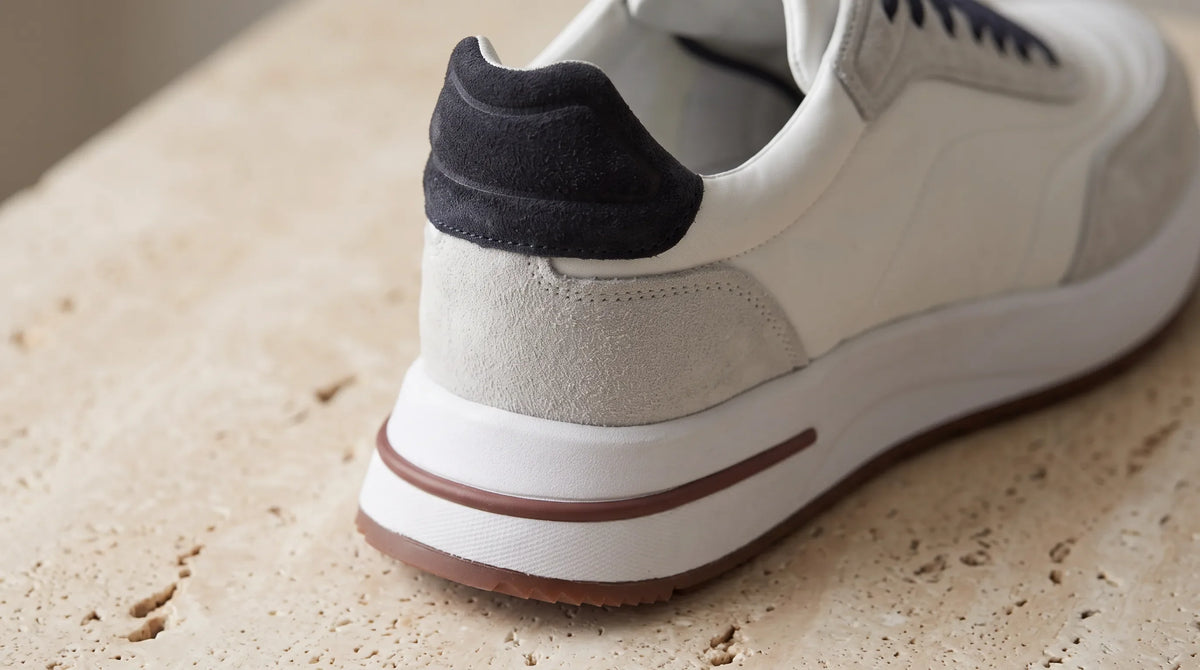 Close-up of the White Portfonio Trainer's striped sole and heel